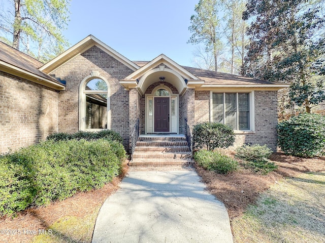 view of front of house featuring brick siding