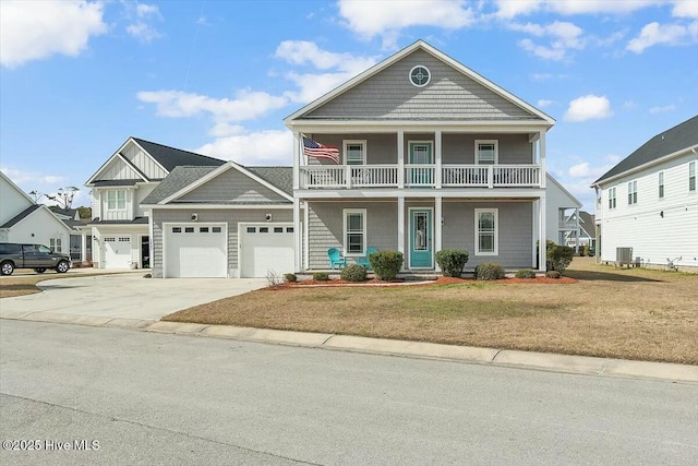 view of front of home with a porch, an attached garage, a balcony, driveway, and a front lawn