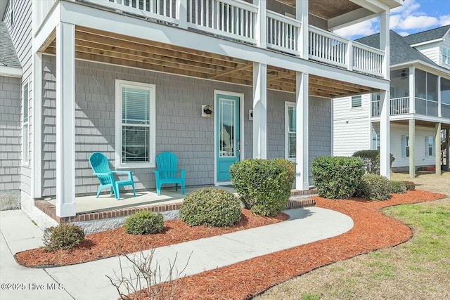 doorway to property featuring covered porch