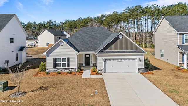 view of front of property with a garage, stone siding, driveway, and board and batten siding