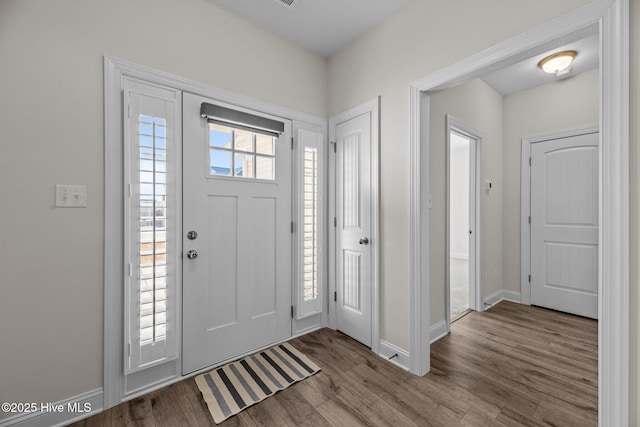 entryway featuring light wood-style floors and baseboards