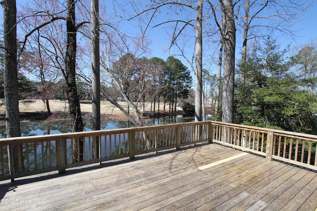 wooden terrace with a water view