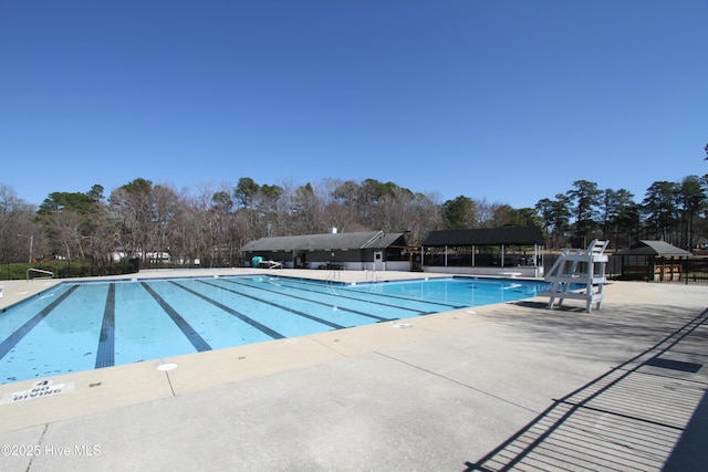 community pool with a patio area