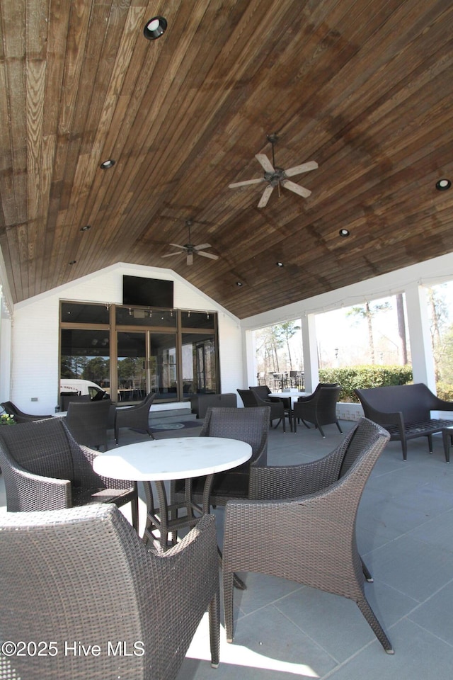 view of patio / terrace with outdoor dining space and ceiling fan