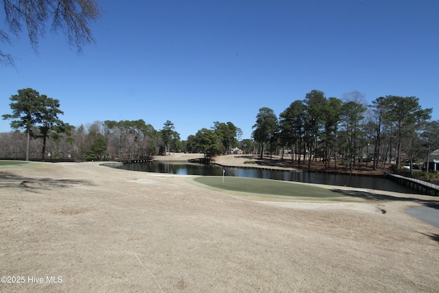 surrounding community featuring a water view