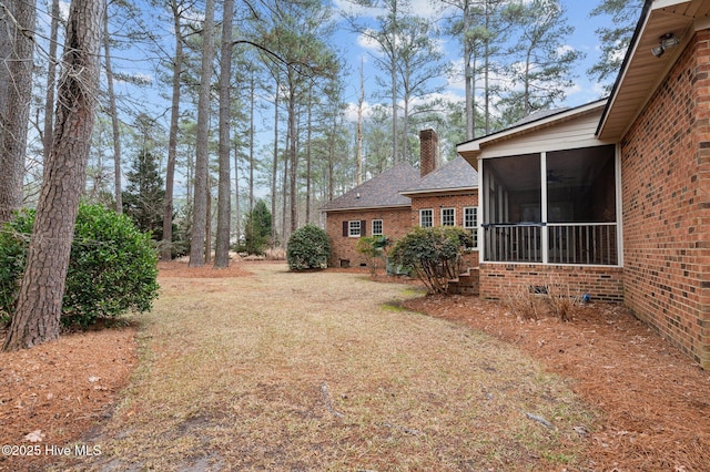 view of yard featuring a sunroom