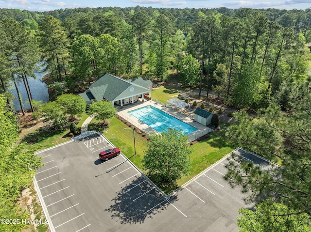 aerial view featuring a wooded view