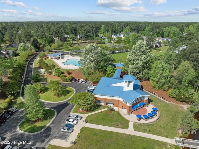 birds eye view of property with a wooded view