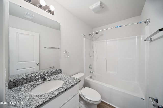 full bathroom with toilet, visible vents, tub / shower combination, and vanity