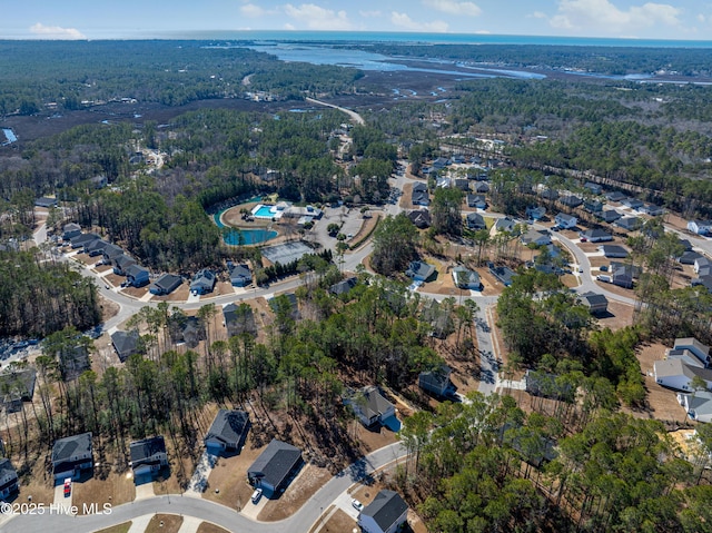 birds eye view of property featuring a residential view and a water view