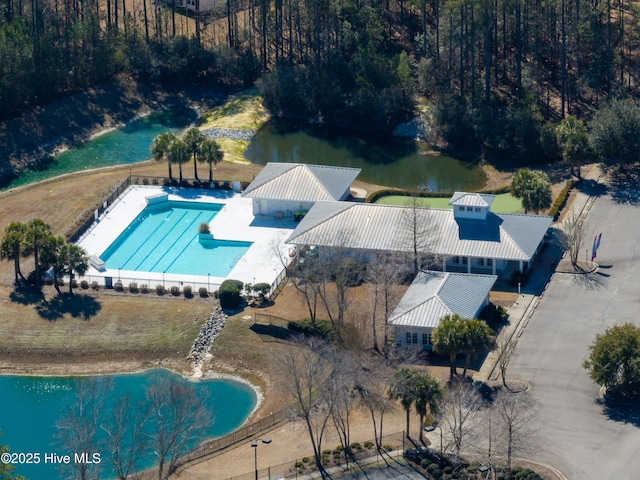 birds eye view of property with a water view