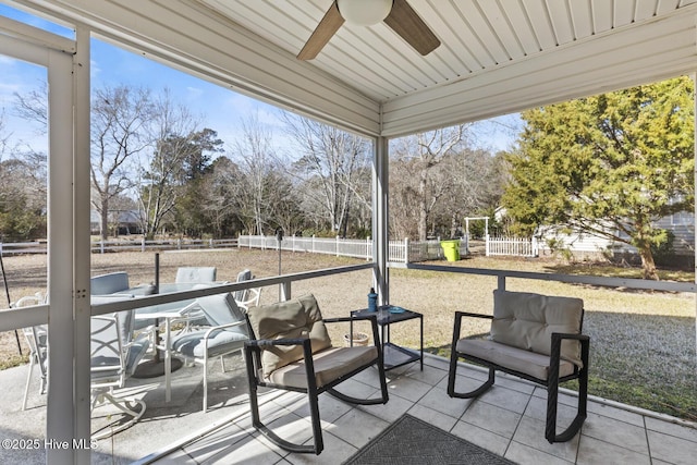 exterior space featuring a ceiling fan