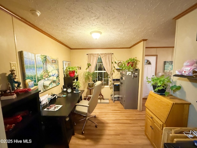 office space with lofted ceiling, light wood-style flooring, ornamental molding, and a textured ceiling