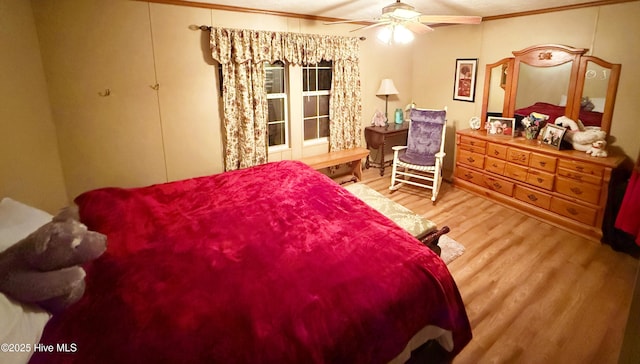 bedroom featuring a ceiling fan and wood finished floors