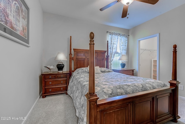 bedroom with light carpet, a ceiling fan, and baseboards