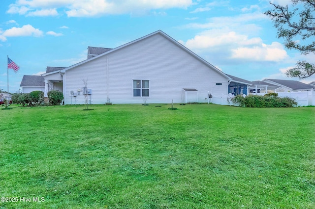 view of side of home featuring a yard