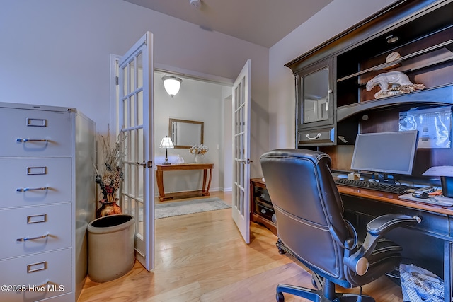 office space featuring french doors and light wood-style floors