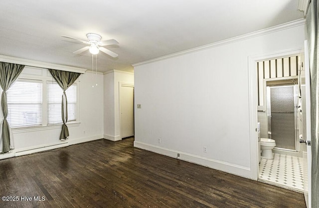 spare room with ornamental molding, a ceiling fan, baseboards, and dark wood-style floors