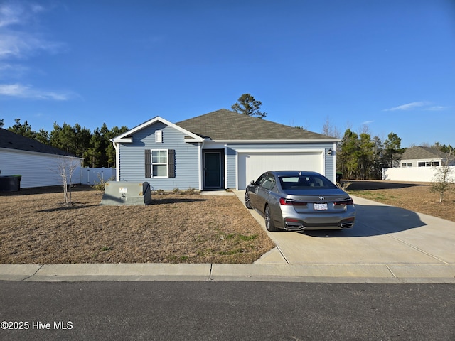 ranch-style home with a garage, driveway, and a shingled roof