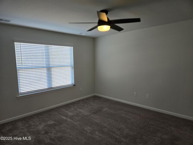 corridor with wood finished floors and baseboards