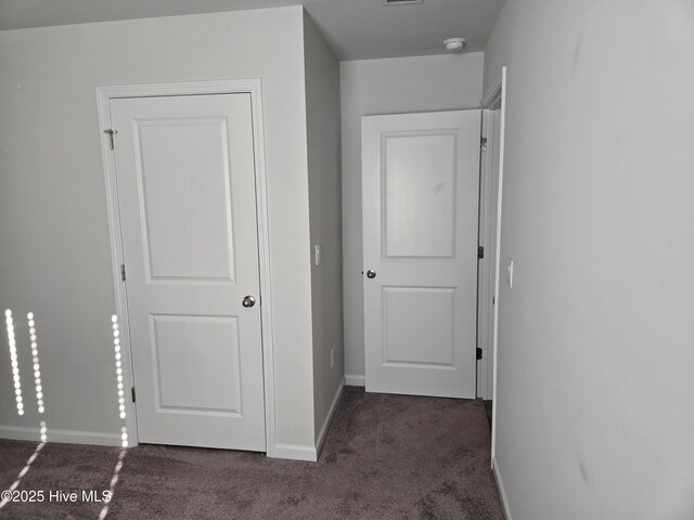 unfurnished bedroom with light colored carpet, visible vents, and baseboards