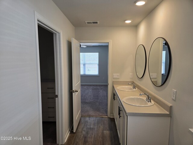 laundry room with laundry area, baseboards, dark wood-style flooring, and washer and dryer