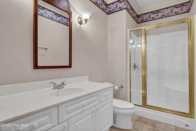 bathroom featuring vanity, a stall shower, tile patterned flooring, and toilet