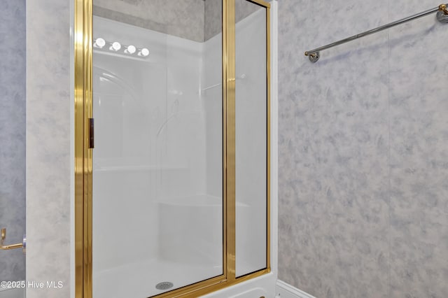 bathroom with a shower with shower door