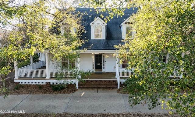 cape cod-style house with a porch