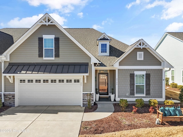 view of front of property featuring a shingled roof, driveway, and a garage