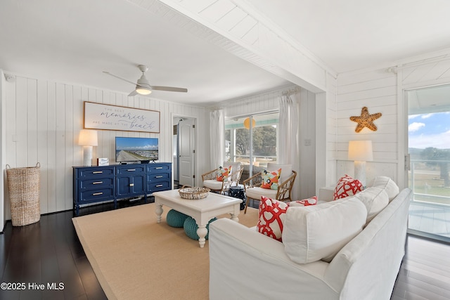 living area featuring dark wood-style floors and ceiling fan