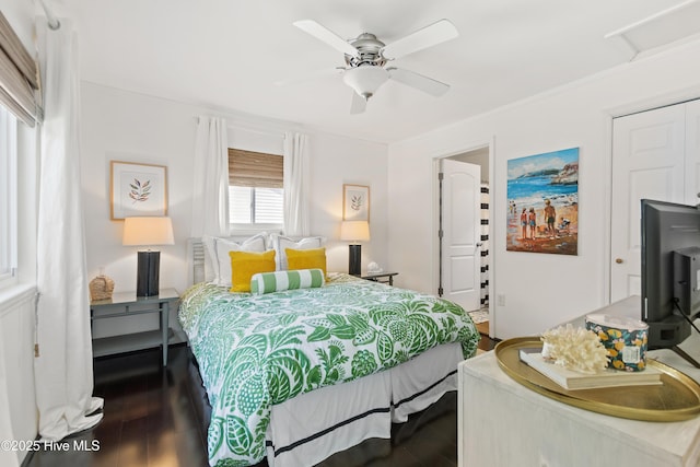 bedroom with a ceiling fan and wood finished floors