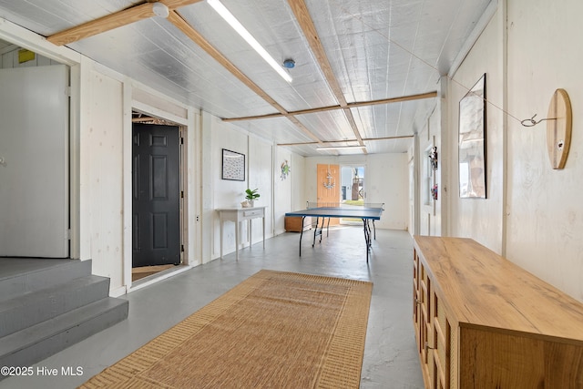 recreation room featuring concrete floors