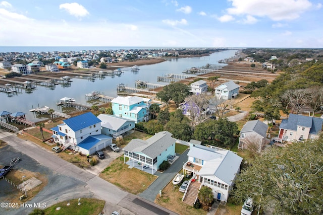 aerial view with a water view and a residential view