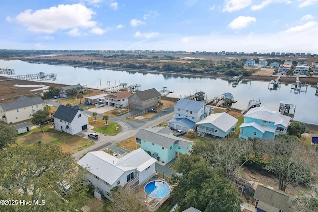 bird's eye view featuring a residential view and a water view