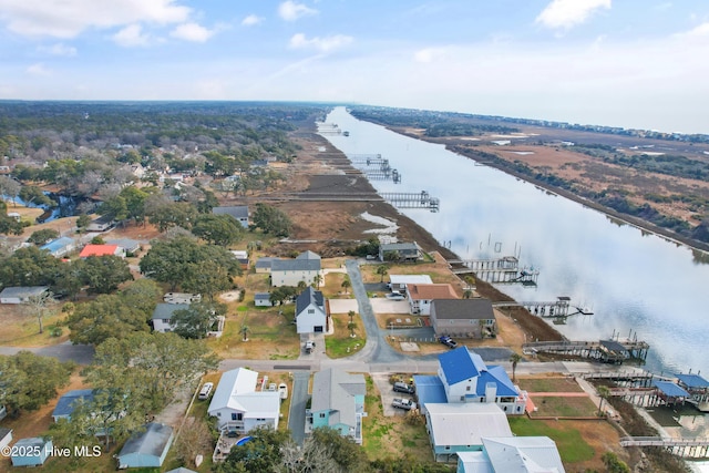 birds eye view of property with a water view and a residential view