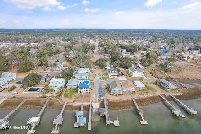 birds eye view of property featuring a water view and a residential view