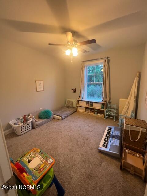 game room featuring carpet and a ceiling fan