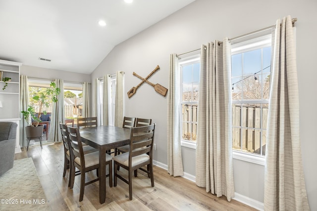 dining room with recessed lighting, wood finished floors, visible vents, baseboards, and vaulted ceiling