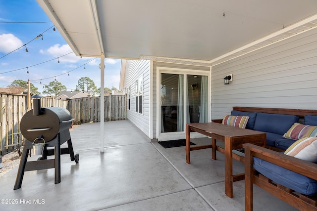 view of patio / terrace with outdoor lounge area and fence