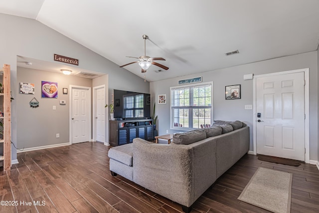 living area with dark wood finished floors, lofted ceiling, visible vents, and ceiling fan