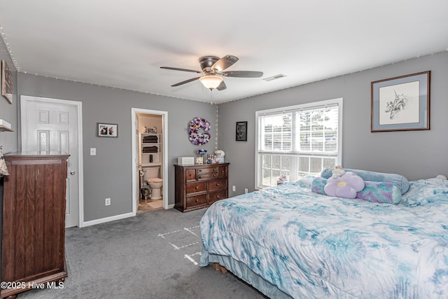 carpeted bedroom featuring visible vents, baseboards, connected bathroom, and a ceiling fan