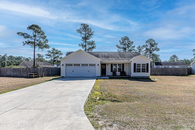 ranch-style home featuring a front lawn, an attached garage, fence, and concrete driveway