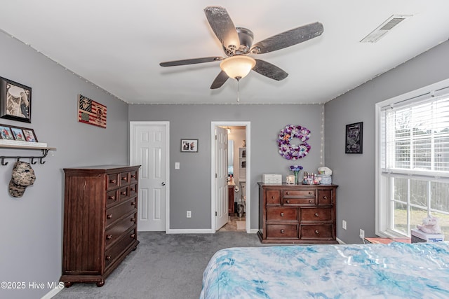 carpeted bedroom featuring visible vents, baseboards, and a ceiling fan