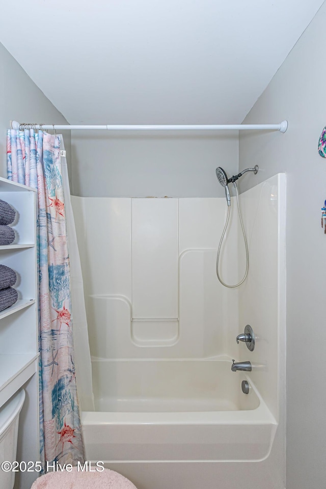 bathroom with shower / tub combo