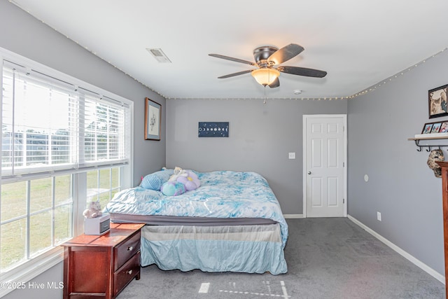 bedroom featuring baseboards, visible vents, carpet floors, and ceiling fan