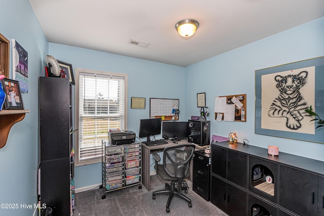 office with visible vents and carpet flooring