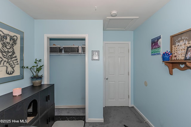 interior space featuring carpet flooring and baseboards