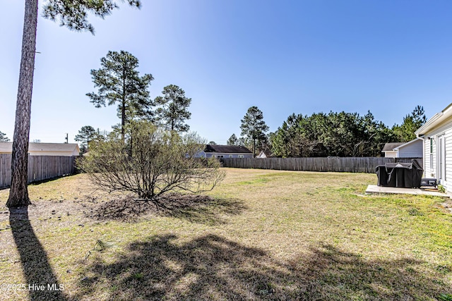 view of yard featuring a fenced backyard