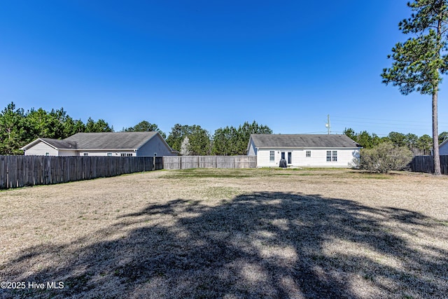 view of yard featuring a fenced backyard